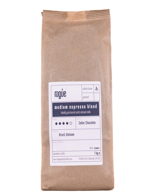 1kg kraft bag of medium espresso blend roast whole bean coffee from Rogue Partner Coffee. Tasting notes are dark chocolate. The origins of the beans are Brazil and Vietnam